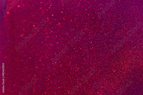 Abstract Red background with small sequins closeup