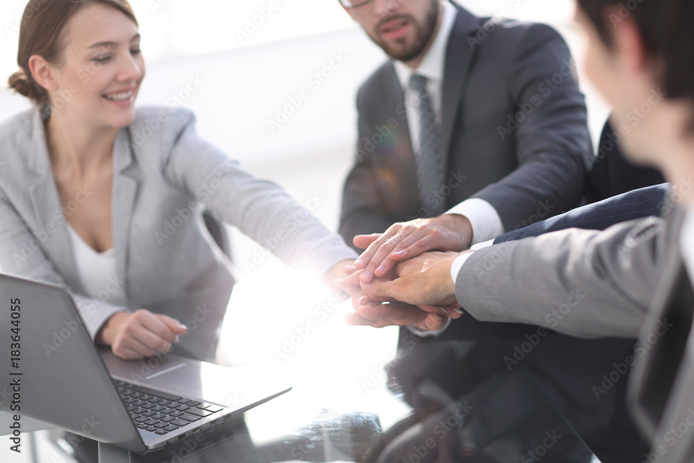 closeup. business team showing their unity. closeup. business team showing their unity.