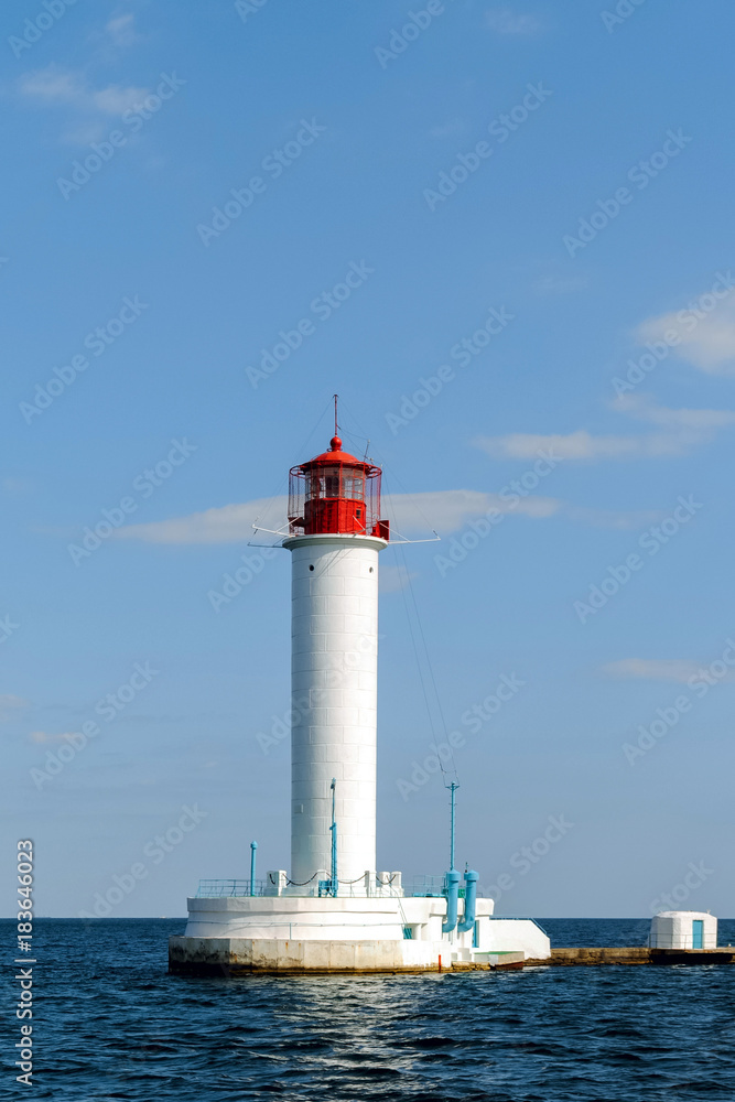 Lighthouse in the afternoon in a calm sea