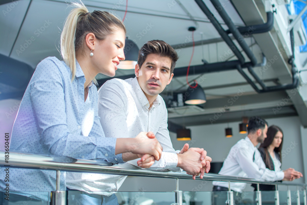 Fototapeta premium Business people talking on office balcony.