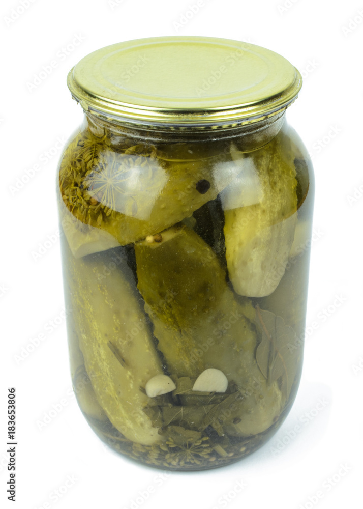 Pickled cucumbers in a glass jar isolated on white Pickled cucumbers in a glass jar isolated on white