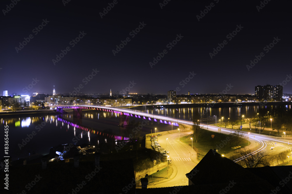 Night view of Novi Sad and rainbow bridge from Petrovaradin fortress