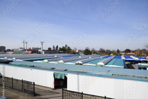 covered market in the city. Rows of sales outlets. View from the bridge to the city market. photo