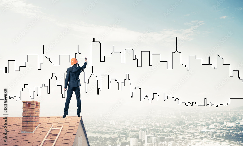 Man architect draw silhouette of modern city on blue sky. Mixed Man architect draw silhouette of modern city on blue sky. Mixed