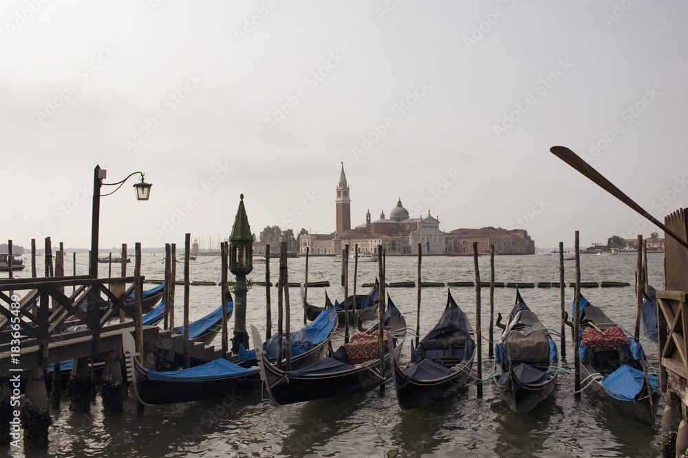 View of Church of San Giorgio Maggiore and many gondolas in the