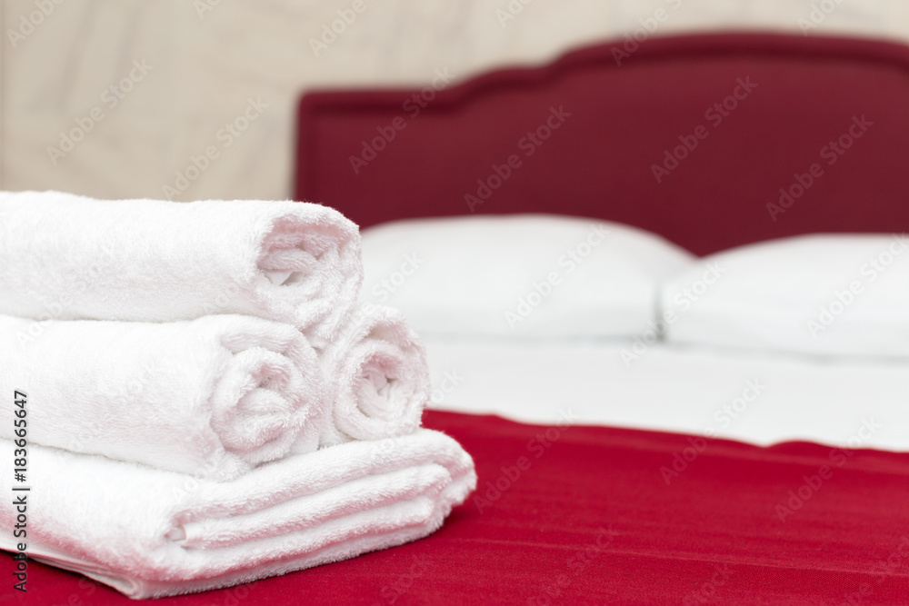 Clean towels on bed at hotel room Clean towels on bed at hotel room