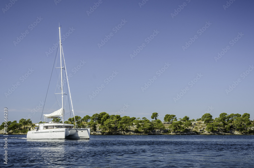 Obraz premium Catamaran sailing on the Sibenik bay