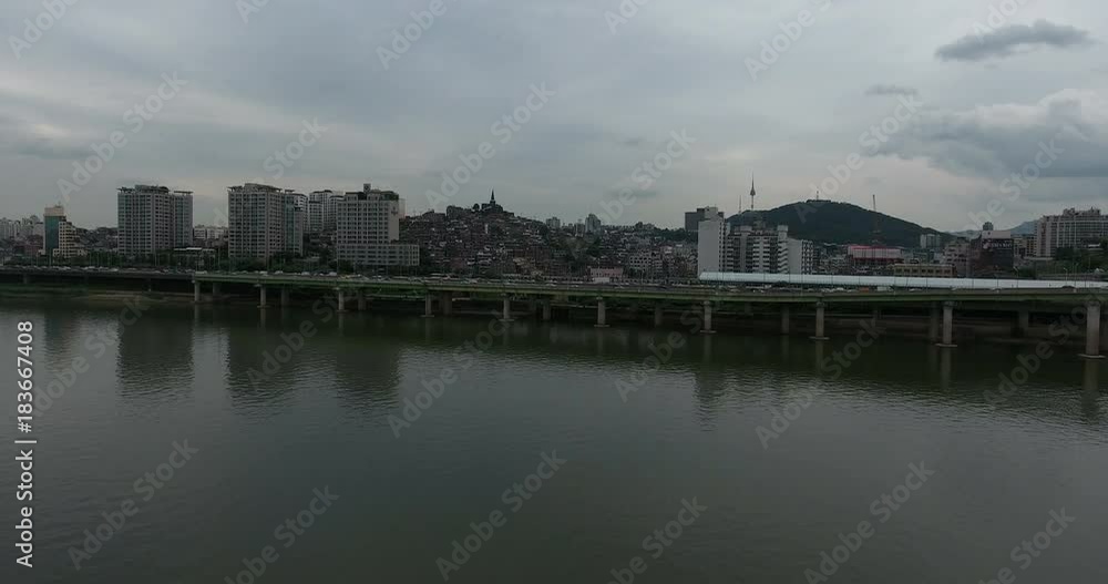 SEOUL, SOUTH KOREA – JULY 216 : Aerial shot over Han River on a cloudy day with traffic and cityscape in view SEOUL, SOUTH KOREA – JULY 216 : Aerial shot over Han River on a cloudy day with traffic and cityscape in view