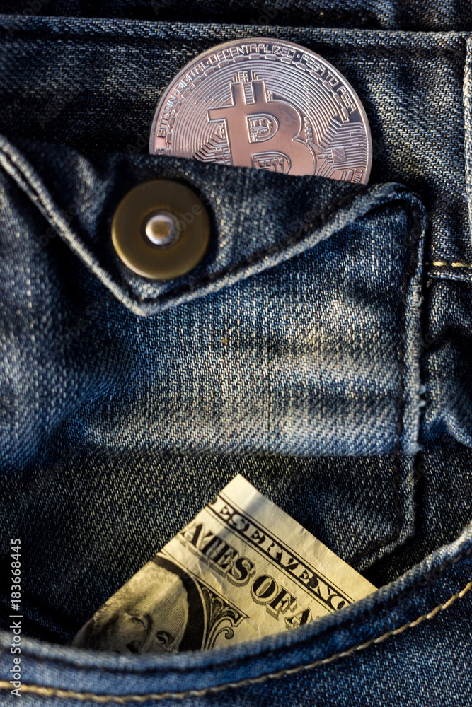 Blue jeans with bitcoin coin and bucks in a pocket. Blue jeans with bitcoin coin and bucks in a pocket.