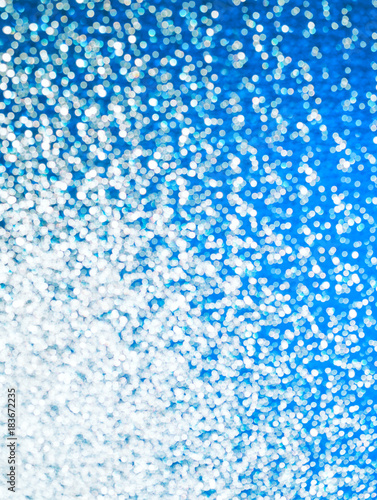 Beautiful bright blue and silver bokeh background (as an abstract festive background)