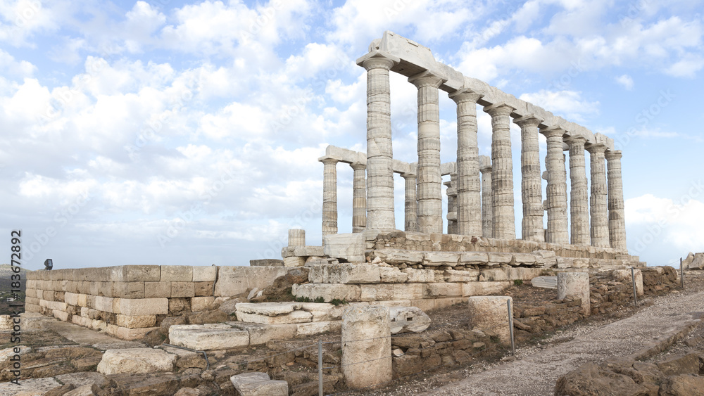 Temple of Poseidon and sky with clouds