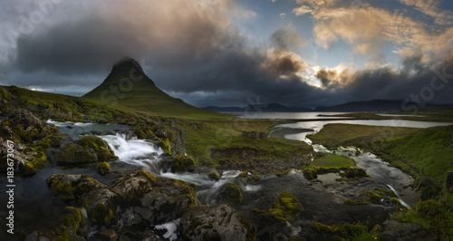 The picturesque sunset over landscapes and waterfalls. Kirkjufell mountain Iceland