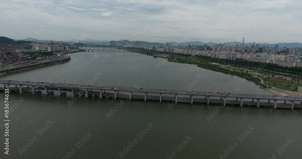 SEOUL, SOUTH KOREA – JULY 216 : Aerial shot over Han River on a cloudy day with Banpo Bridge traffic and cityscape in view SEOUL, SOUTH KOREA – JULY 216 : Aerial shot over Han River on a cloudy day with Banpo Bridge traffic and cityscape in view