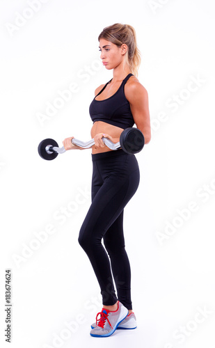 fitness woman with sports bar on a light background