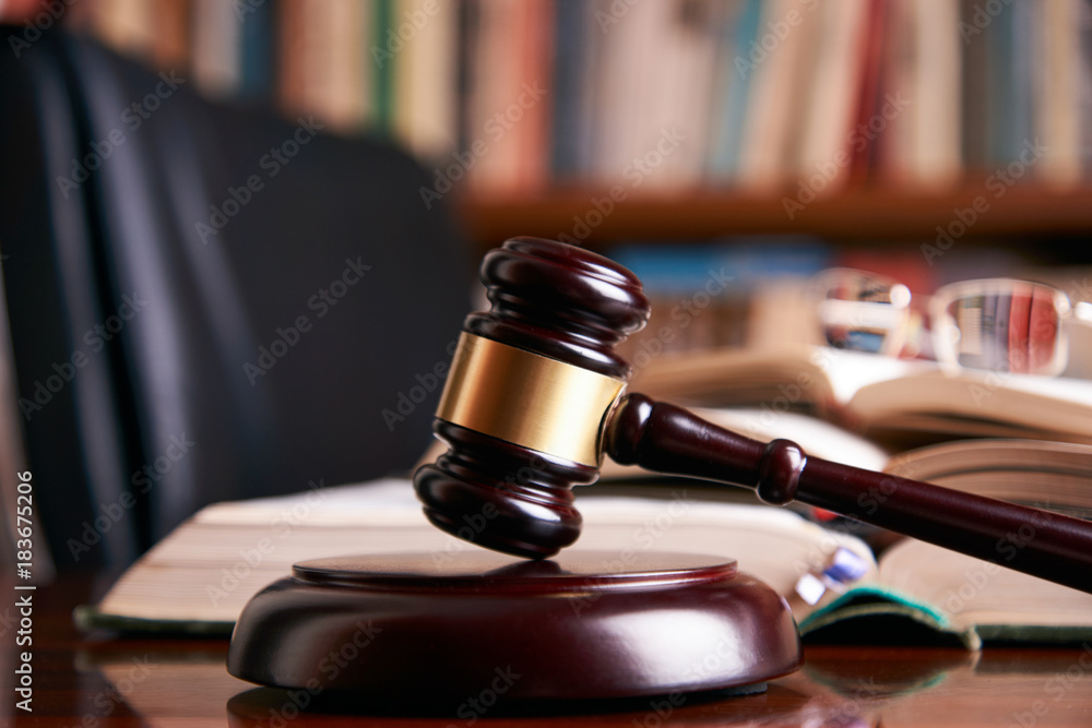 Judge gavel or law mallet on a wooden desk Judge gavel or law mallet on a wooden desk