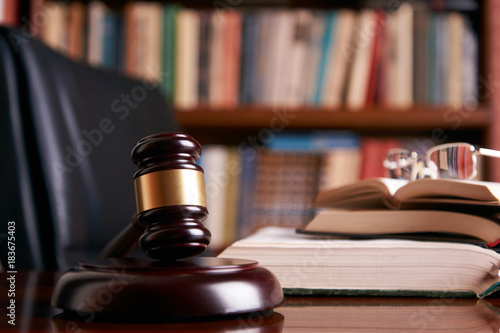 Judge gavel or law mallet on a wooden desk