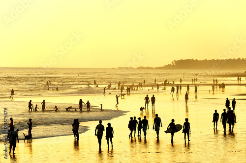 People walking on  beach. Bali