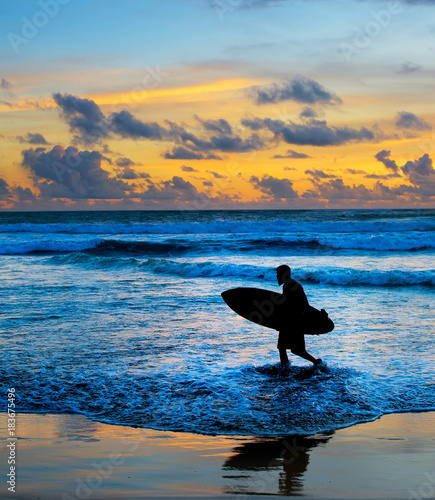 Photography Silhouette of surfer at sunset