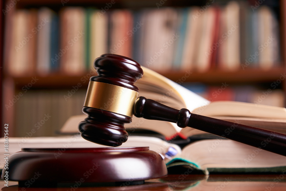 Law gavel or judge mallet on a wooden desk Law gavel or judge mallet on a wooden desk
