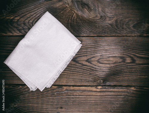 kitchen napkin on a brown wooden background