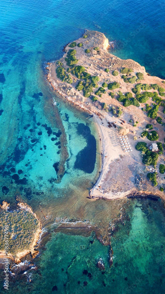 Autumn 2017: Aerial bird's eye view photo taken by drone depicting beautiful deep blue -  turquoise waters and rocky seascape