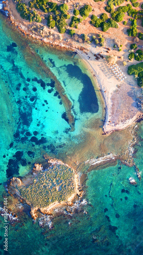Autumn 2017: Aerial bird's eye view photo taken by drone depicting beautiful deep blue - turquoise waters and rocky seascape