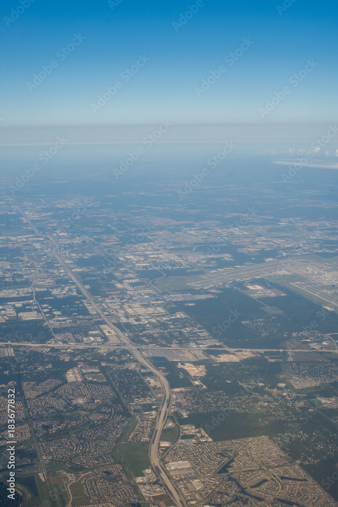 Metropolis Area of Houston, Texas Suburbs from Above in an Airplane Metropolis Area of Houston, Texas Suburbs from Above in an Airplane