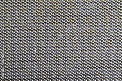  metal covered with lines of circular holes