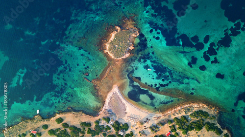 Autumn 2017: Aerial bird's eye view photo taken by drone depicting beautiful deep blue - turquoise waters and rocky seascape