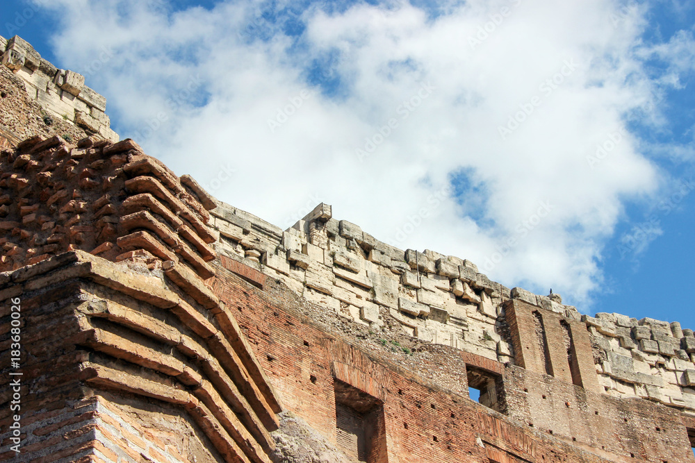 old ruins of colosseum with blue sky in Rome