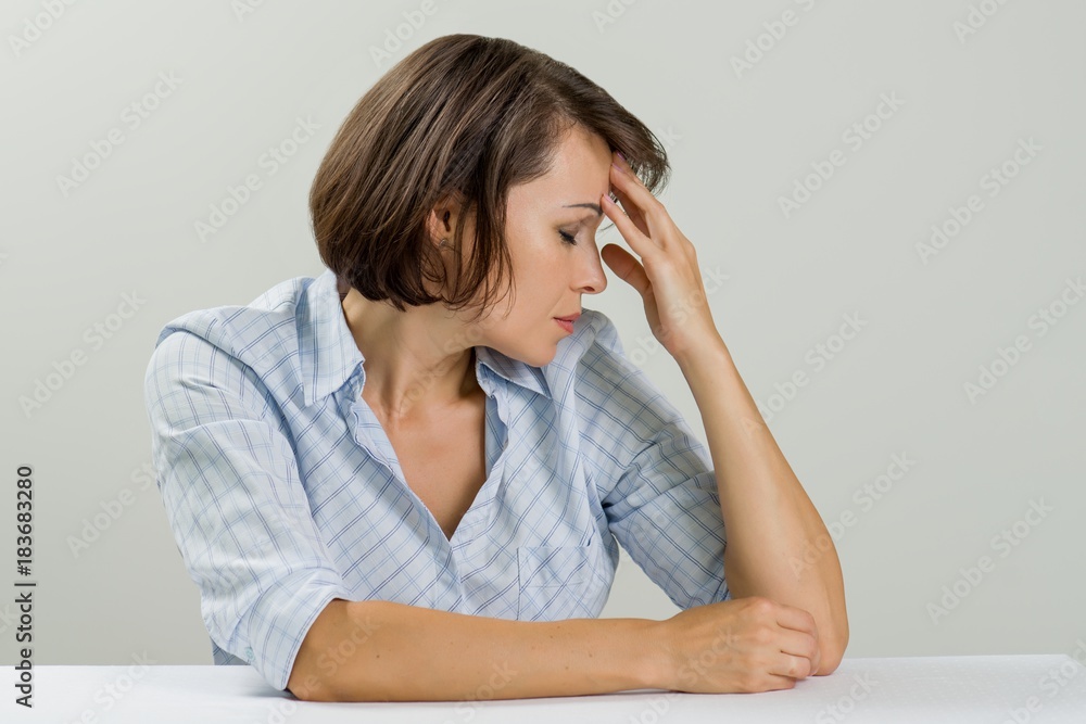 Stressed adult woman covering her face with hands Stressed adult woman covering her face with hands