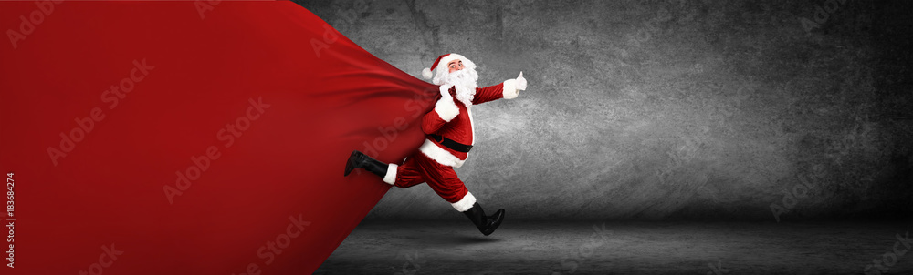 Weihnachtsmann mit einem Sack voller Geschenke! - obrazy, fototapety, plakaty 
