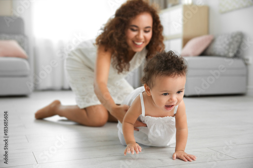 Cute baby and young mother ...
