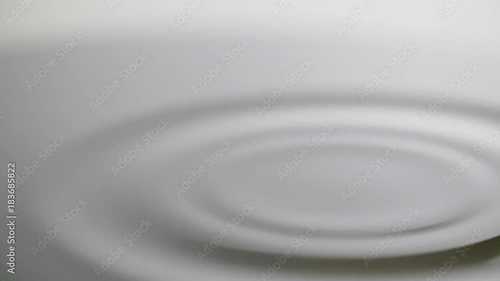 Water drop drips to liquid surface Full HD slow-motion video nature background. Clean rain waterdrop falling and splashing. Gray abstract circles Water drop drips to liquid surface Full HD slow-motion video nature background. Clean rain waterdrop falling and splashing. Gray abstract circles