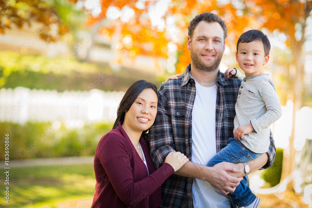 Outdoor Portrait of Mixed Race Chinese and Caucasian Parents and Child. Outdoor Portrait of Mixed Race Chinese and Caucasian Parents and Child.