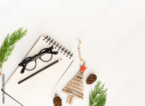Holiday Planning concept. Home office desk with notebook. Christmas Working Concept. Flat lay composition
