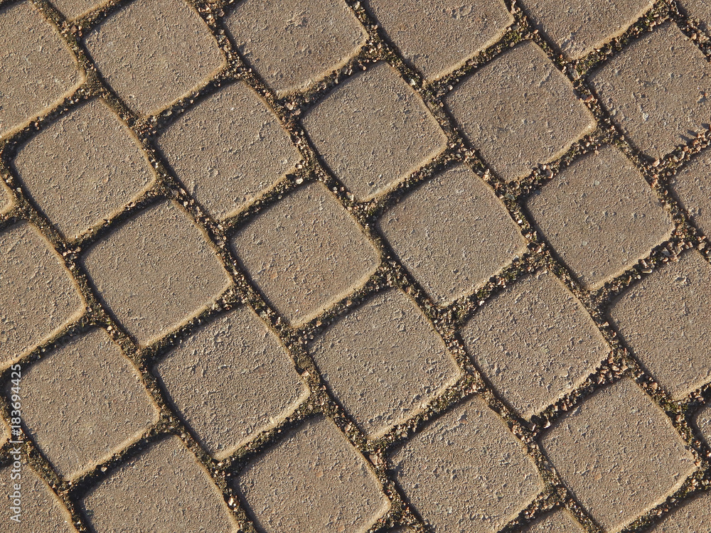 Obraz premium Textured background of a grey pavement stone