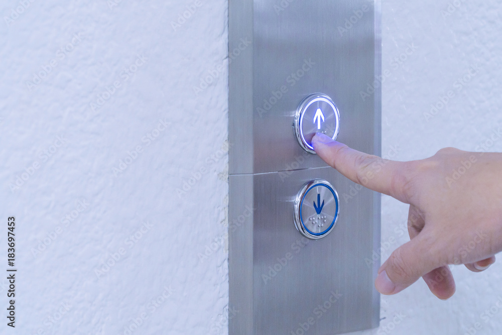 Naklejka premium Using hands, press the elevator up and keypad elevator