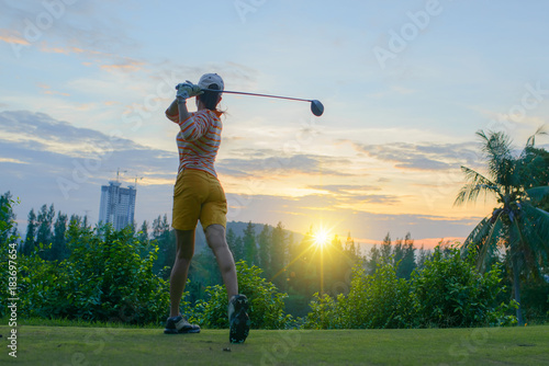 Obraz na plátne woman golf player in action of end downswing of wood driver, after hit the golf