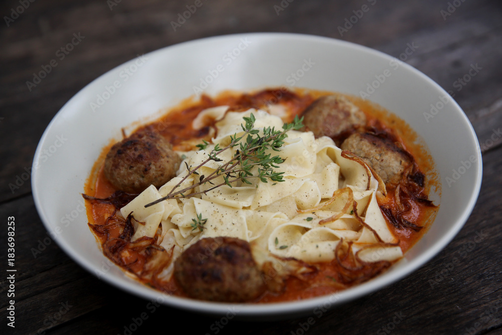 Pasta meatballs tomato sauce on wood background