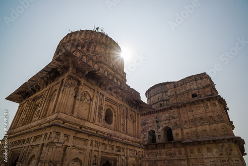Cenotaphs at Orchha, Madhya Pradesh. Also spelled Orcha, famous travel destination in India. Backlight, sunstar, blue sky.