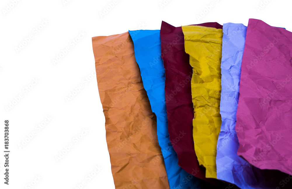 crumpled colour paper on white background with copy space