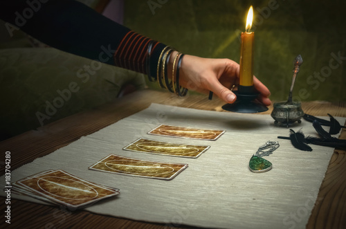 Tarot cards on fortune teller desk table. Future reading.