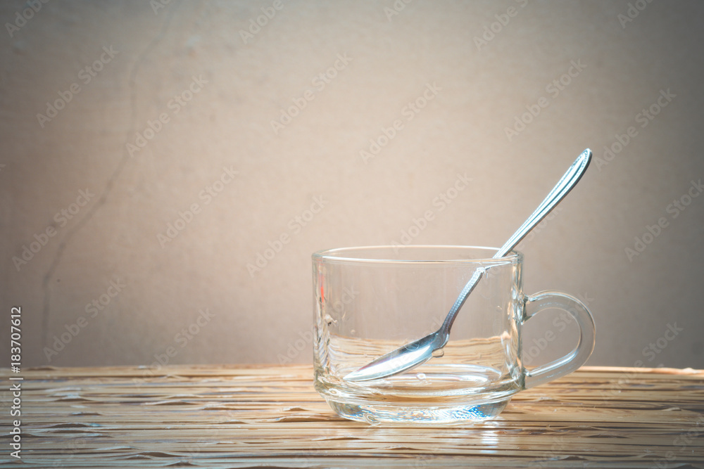 Empty coffee cup and spoon on wooden table. Empty coffee cup and spoon on wooden table.