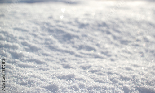 Snow background with tiny heart bokeh