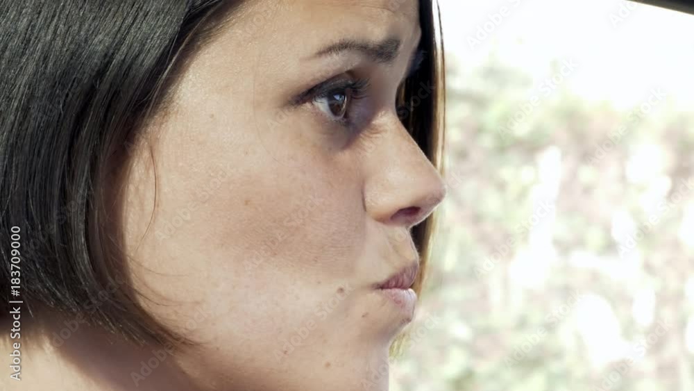 Worried woman driving fear of accident tracking shot Worried woman driving fear of accident tracking shot
