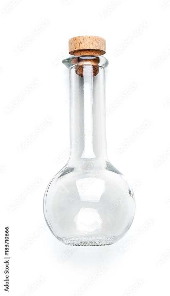 Transparent glass bottle of unusual shape with a wooden lid on a clean white background.. Transparent glass bottle of unusual shape with a wooden lid on a clean white background..