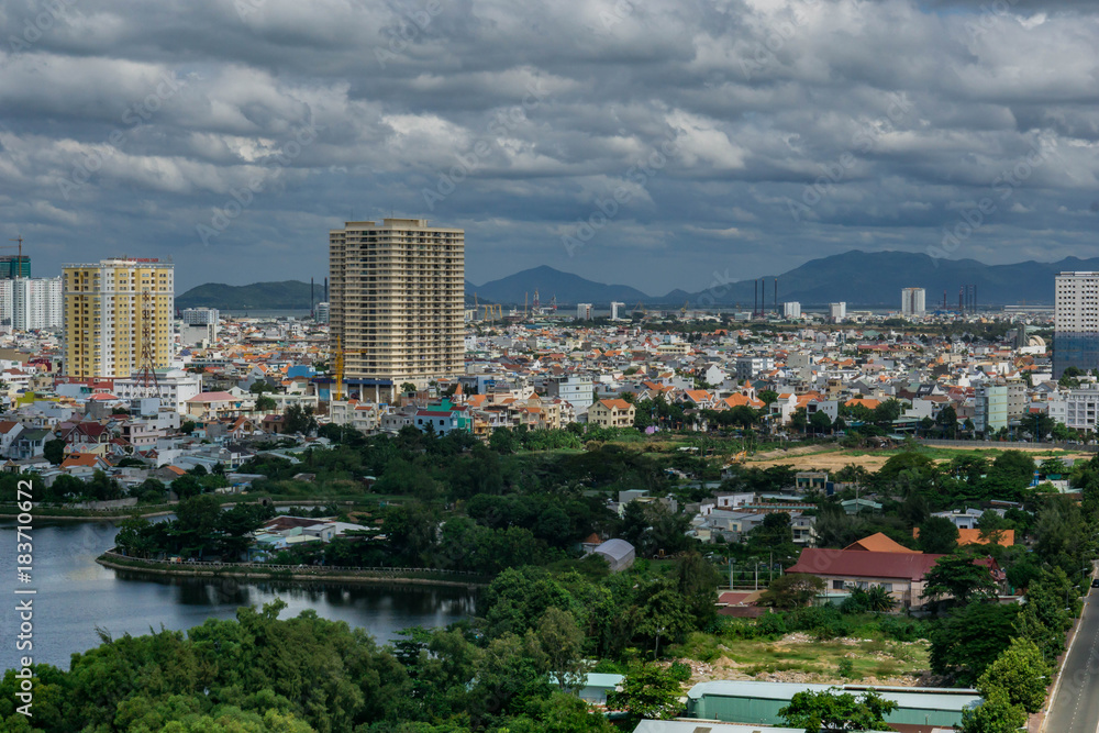 Landscape view from the top, lake, hills, buildings and cloudy sky. Vung Tau, Vietnam. Landscape view from the top, lake, hills, buildings and cloudy sky. Vung Tau, Vietnam.