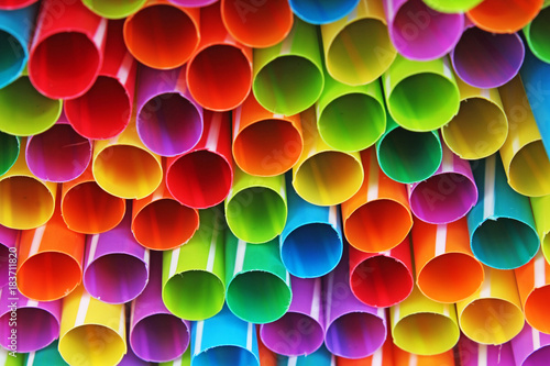 Fancy straw art background. Abstract wallpaper of colored fancy straws. Rainb...