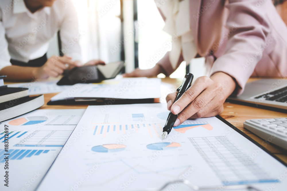 Business women analysis investment perform data document and calculating a valuation number Business women analysis investment perform data document and calculating a valuation number